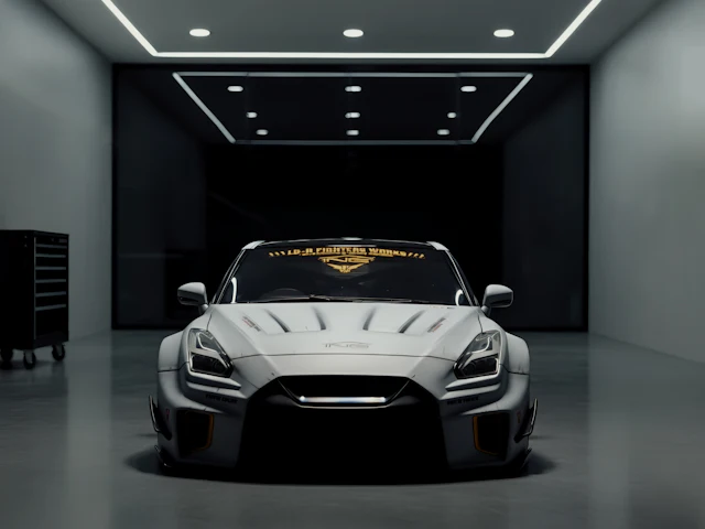 A white sports car on the floor of a clean, modern showroom.